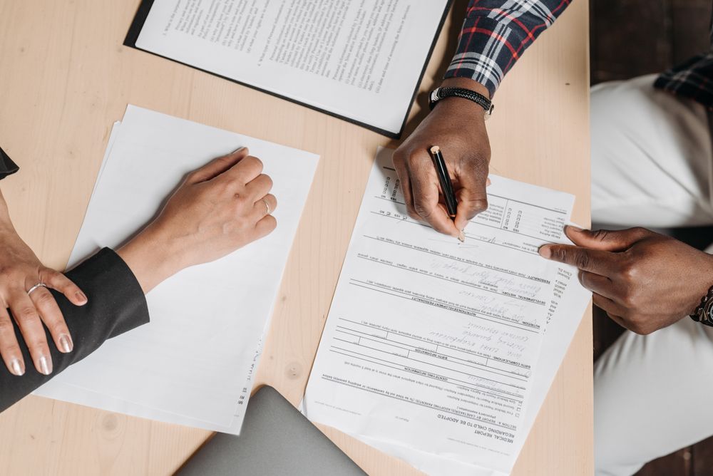 Auto insurance paperwork being completed at the Coastline office desk