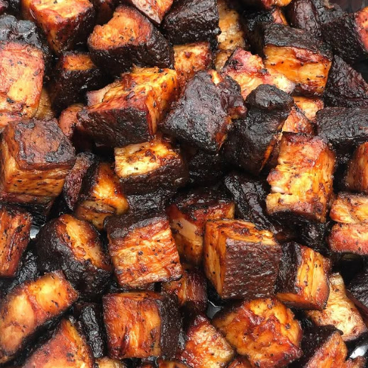 A tray of caramelized brisket burnt ends.