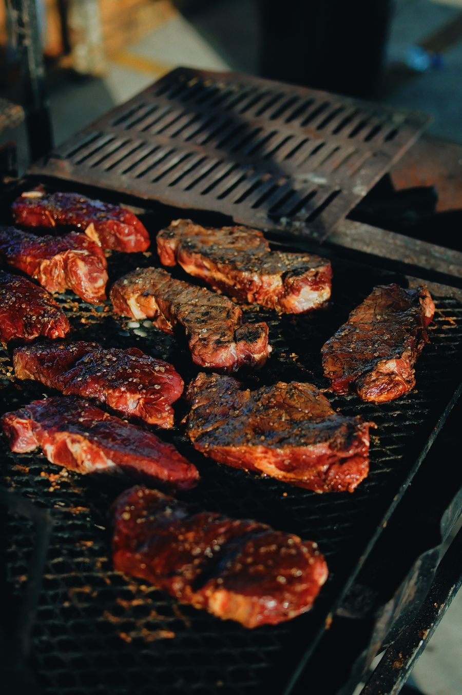 Freshly smoked meat with a deep bark on the grill